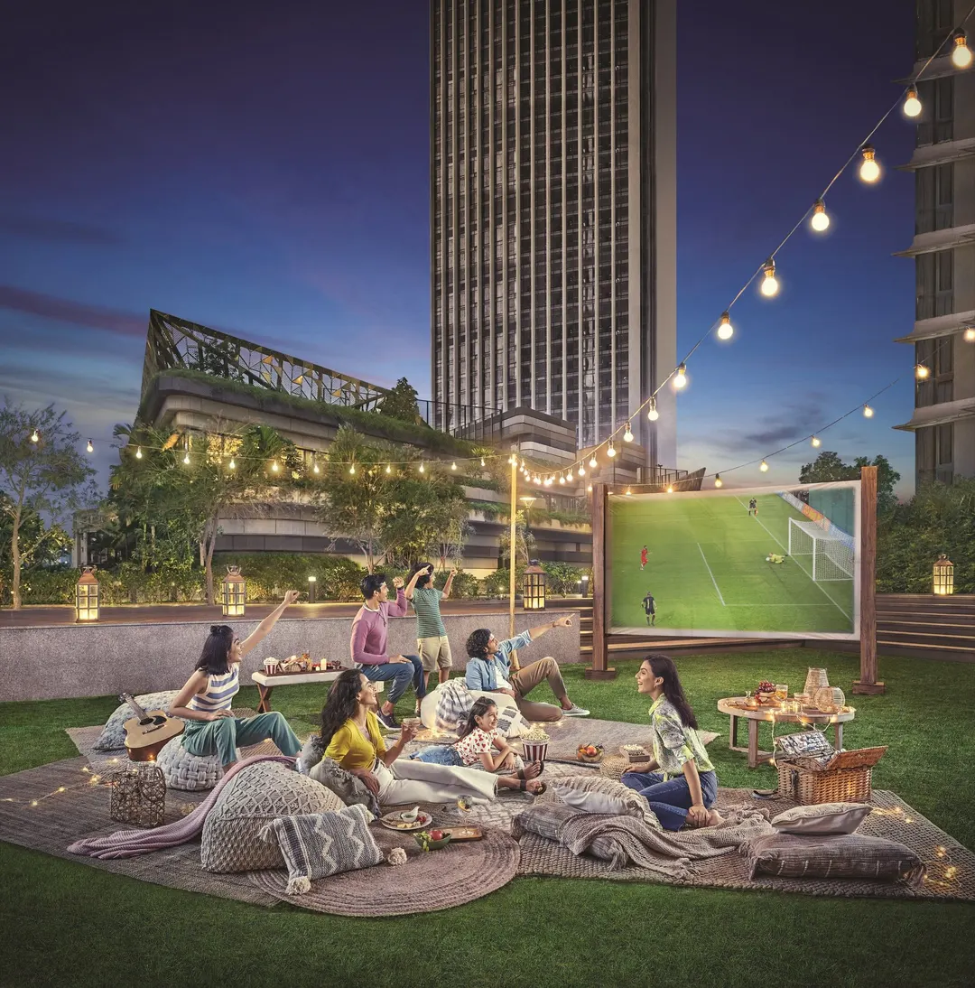 Neighbours gathered on the lawn for an open-air screening under string lights